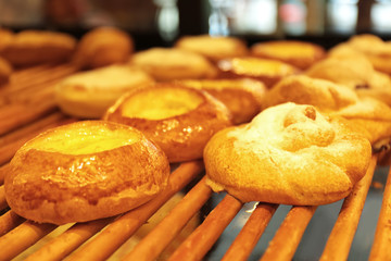 Counter with bakery products in shop, closeup