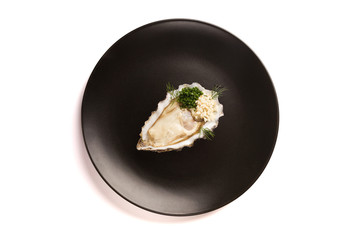 Delicious oyster on a black plate