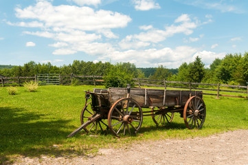Wooden Wagon in a Field on a Farm