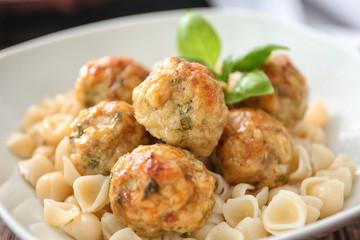 Bowl with turkey meatballs and pasta, closeup