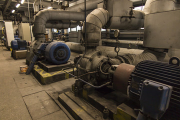 some old, dusty, pumps for hot and cold water