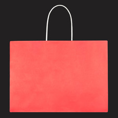 Red shopping paper bag on black background