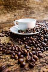 Coffee. Coffee beans. Coffee cup full of coffee beans.