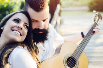 portrait of two young people with guitar