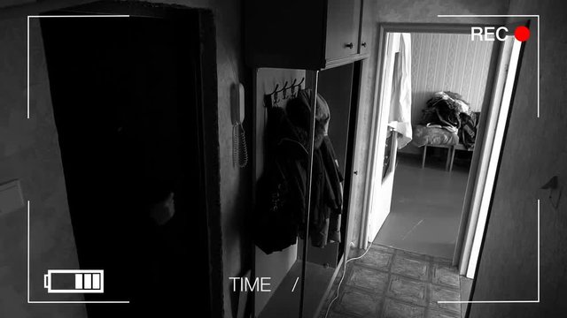 Real surveillance cameras filmed and recorded by a burglar with a gun to get into the house.