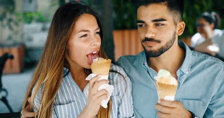 Happy couple having date and eating ice cream - Powered by Adobe