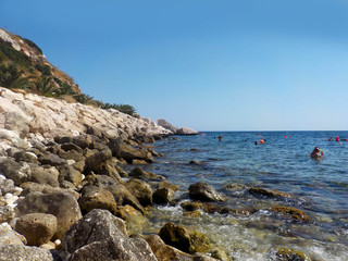 Spanish coast. Peñon de Ifach stony beach, Calpe, Spain