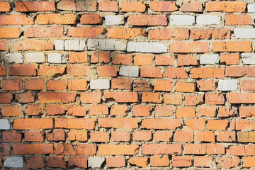 Obraz premium Vintage ruined brick wall with cracks, background and texture, natural design, patterns, extured background with space for text.