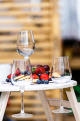 Wine glasses and fresh berries. Why this design is not know.