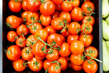 Tomatoes are on the shelves in the supermarket