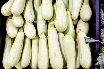 Courgettes (zucchini) are on the shelves in the supermarket