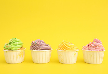 tasty birthday cupcake with  yellow background