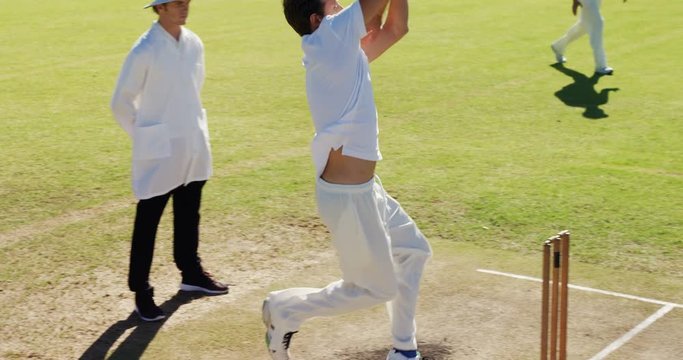 Bowler delivering ball during cricket match