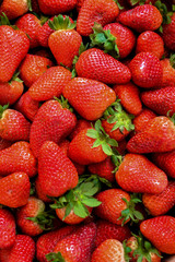 Closeup on strawberries in basket, strawberry basket, strawberries on wooden table, basket with strawberries, strawberries in natural background