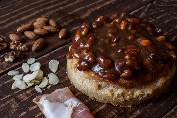 Australian meat  pie on the table and avocado, chilli, chips, rustic style. Homemade meat pie on the wooden table. Delicious cut meat pie on a plate. American Chicken pot pie