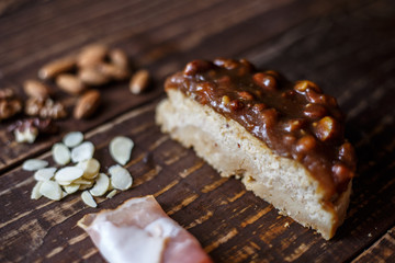 Australian meat  pie on the table and avocado, chilli, chips, rustic style. Homemade meat pie on the wooden table. Delicious cut meat pie on a plate. American Chicken pot pie