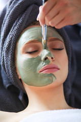 Beautiful woman having mask , lying on spa . Woman. Spa salon