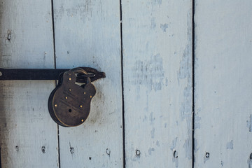 iron lock on wooden door
