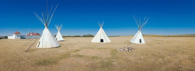 teepees in field