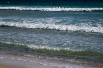 Foamy waves  breaking close to the beach