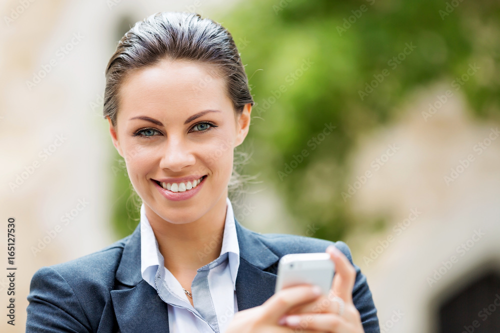 Wall mural portrait of business woman smiling outdoor