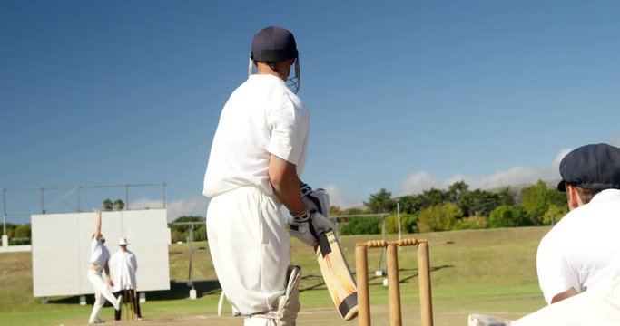 Bowler delivering ball during cricket match