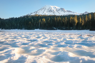 Mount Rainier from a snow-covered Reflection Lake in June