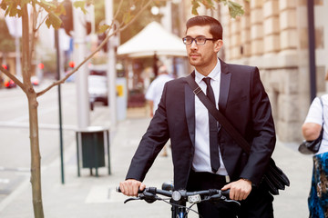 Young businessmen with a bike