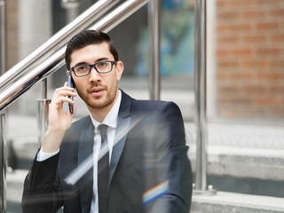 Fototapeta premium Portrait of handsome businessman outdoor