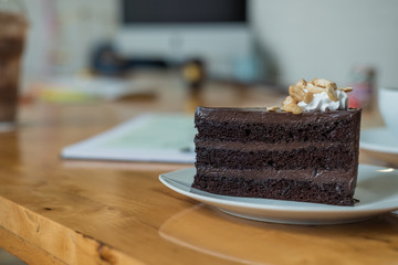 A piece of chocolate cake on the table, close-up