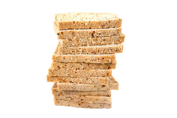 Pile of whole wheat bread isolated on white background