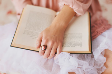 Girl holding old book