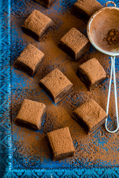 Chocolate fudge dusted with cocoa powder