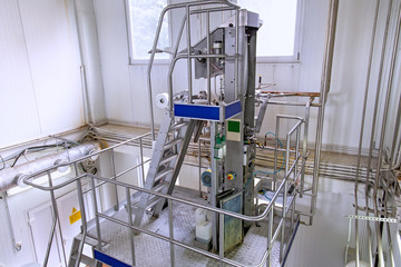 Industrial dairy production. View on the equipment on the milk factory.