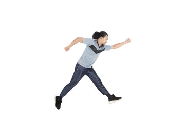 Sporty Afro man running in studio