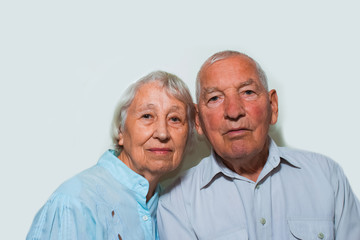 The elderly couple on studio background