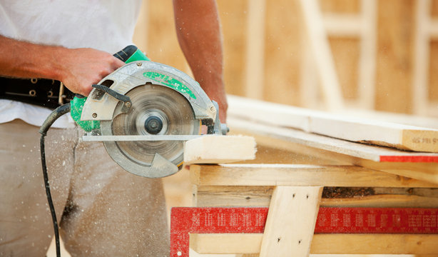 Construction: Sawdust Flies As Framer Cuts Wood