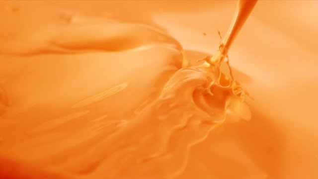 Pouring Orange paint.