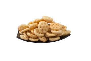 isolated wheeler corn rings or snacks in black plate