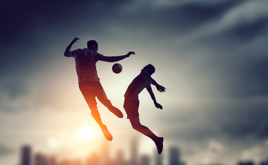 Fototapeta na wymiar Soccer players fighting for ball