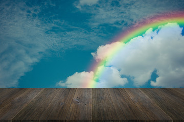Blue sky cloud with Wood terrace and rainbow , process in vintage style