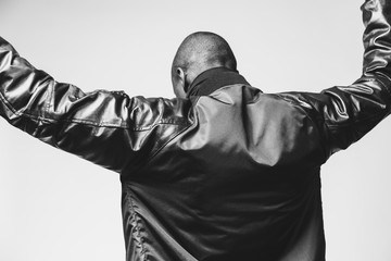 Black & white studio portraits of a fashionable young black man