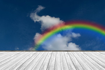 Wood terrace and Blue sky with rainbow