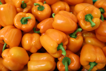 Fresh orange peppers on the market
