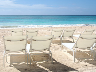 Sunchairs on tropical island