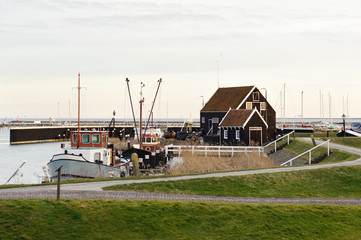 Fototapeta premium Old traditional wooden house near the lake somewhere in Holland
