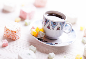 traditional oriental nougat with turkish coffee on a wicker tray