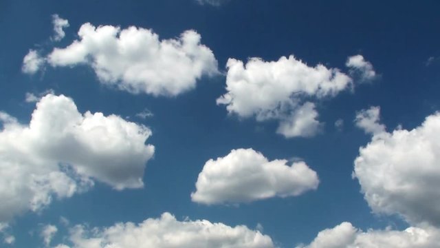 Time lapse moving clouds on a blue sky as background. HD 1920x1080 Video Clip