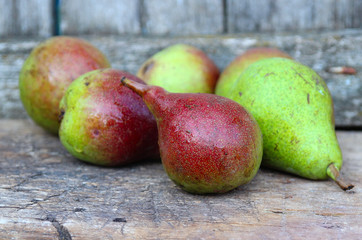 Ripe, sweet pears on a wooden background. fresh fruits