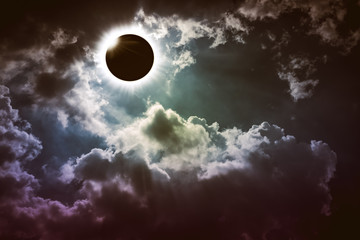 Amazing scientific natural phenomenon. Total solar eclipse glowing on sky.